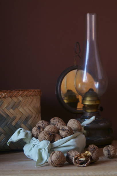 istock Rustic arrangement with walnuts on a wooden table 1199054643