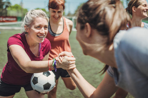 istock Women handshake on a soccer playing field 1199054804