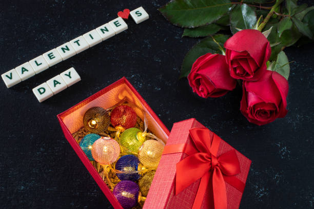 istock Valentine’s day concept with red roses on the table. 1199055611