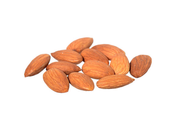 istock Tasty almonds nuts isolated on white background 1199056689