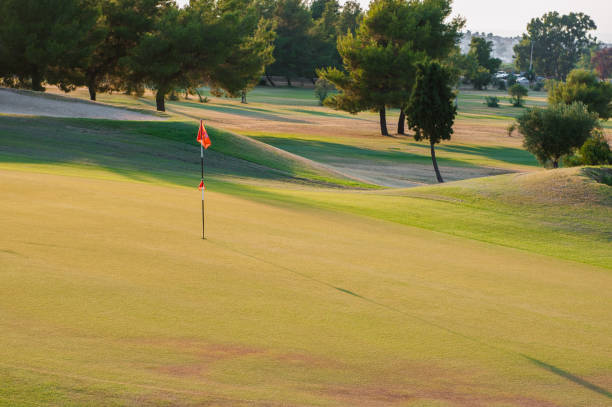 istock golf course at sunset, empty golf club 1199059419