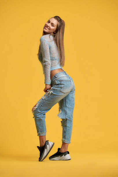 istock Cheerful girl looking back, tilting head back 1199060500