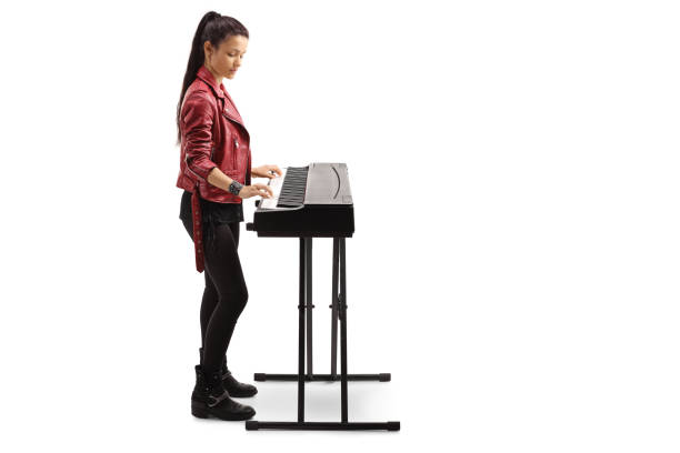 istock Young woman playing a digital piano 1199061764