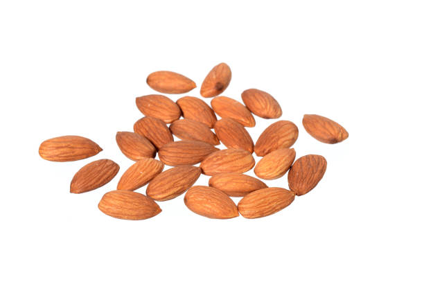 istock Tasty almonds nuts isolated on white background 1199061929