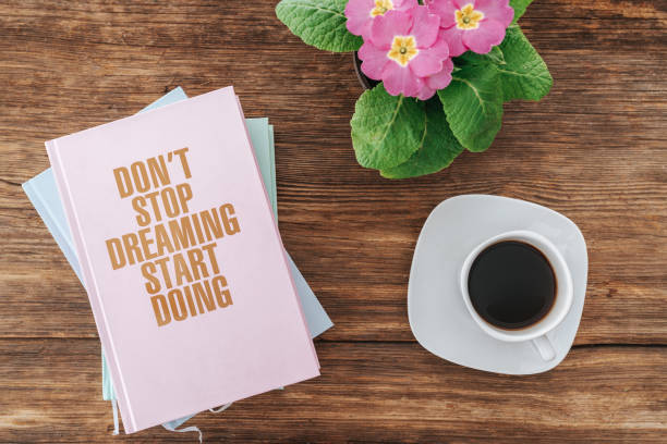 istock closeup of reading self improvement books with nice decoration. Learning postive motivation cocept. 1199062524