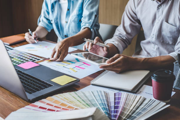 istock Team of Creative Web/Graphic Designer planning, drawing website ux app for mobile phone application and development template layout, process to developing prototype wireframe, User experience concept 1199062577