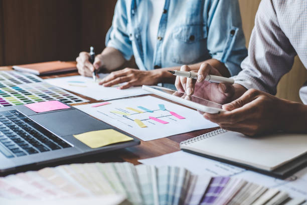 istock Team of Creative Web/Graphic Designer planning, drawing website ux app for mobile phone application and development template layout, process to developing prototype wireframe, User experience concept 1199062579