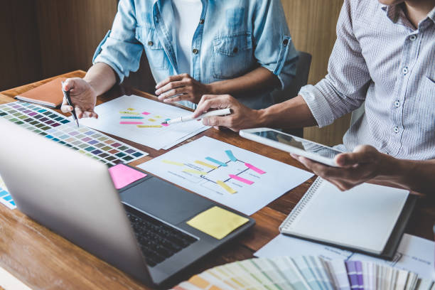 istock Team of Creative Web/Graphic Designer planning, drawing website ux app for mobile phone application and development template layout, process to developing prototype wireframe, User experience concept 1199062585