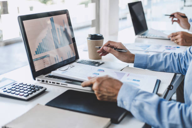 istock Professional Business teamwork conference project success financial statistics growth profit, Partner meeting business investor working start up project for both company with document data graph 1199062673