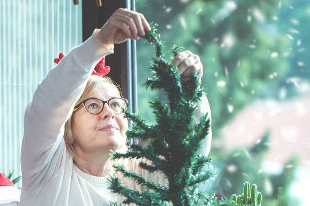 istock Celebrating Christmas, decorating the christmas tree 1199062748