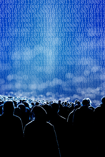 Conceptual technology image of Large group of silhouetted people and binary code of one and zero