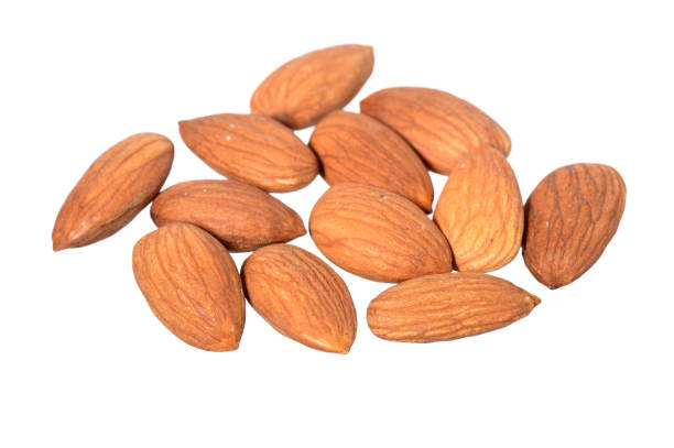 istock Tasty almonds nuts isolated on white background 1199065475