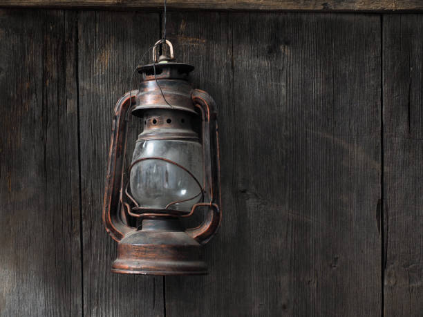 An old kerosene lamp on a wooden wall
