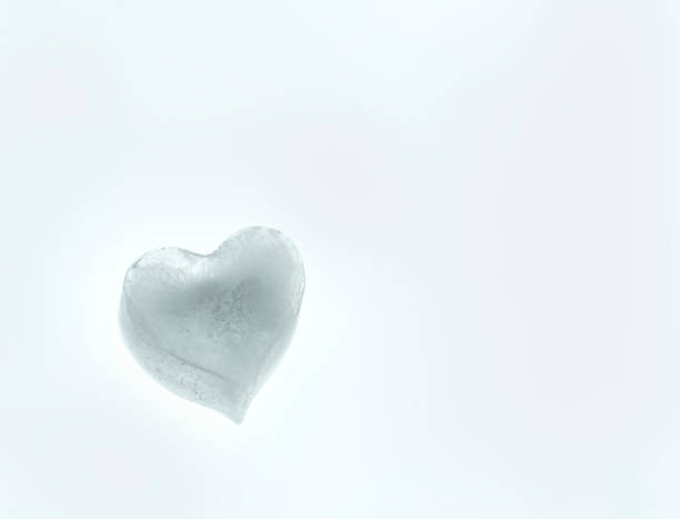 istock heart shape made of ice on plain white background 1199068502