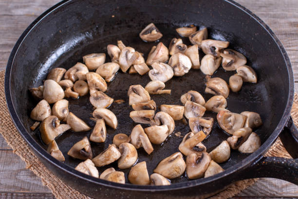 istock Fried mushrooms in frying pan 1199070536