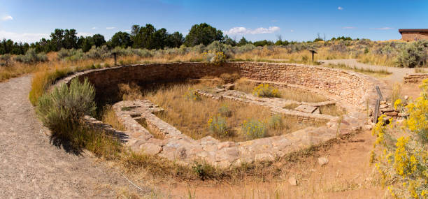 Canyons of Ancients Lowry Pueblo - Great Kiva Looking West Panorama Canyons of Ancients National Monument Lowry Pueblo - Great Kiva Looking West Panorama rabbit brush stock pictures, royalty-free photos & images
