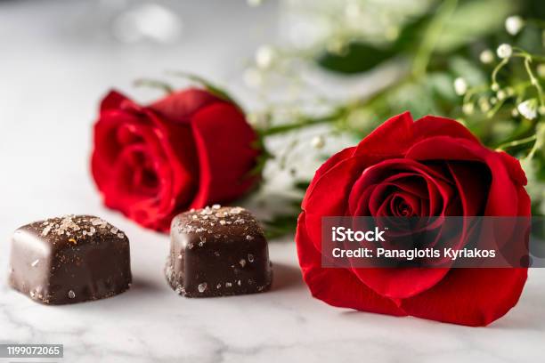 2 Pieces Roses Two Red Roses And Chocolate Pieces Stock Photo - Download Image Now ...