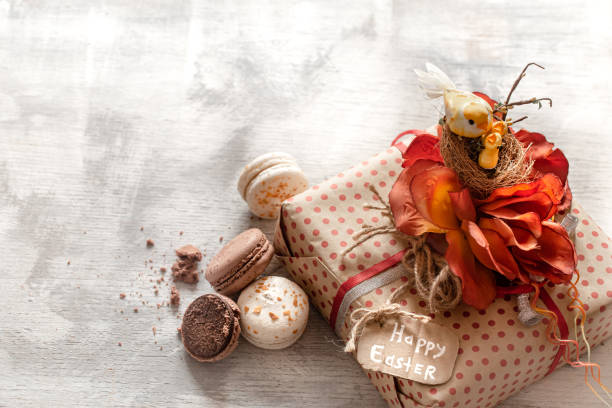 istock Easter gift and sweets on a wooden background. 1199073365
