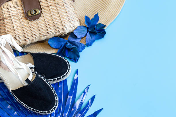 istock Summer accessories, shoes and hat with bag on blue background. 1199073783