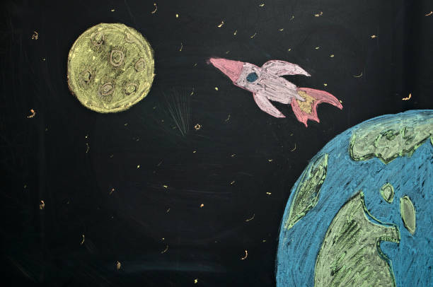 istock drawing chalk on the board rocket flying from earth to the Moon 1199074943