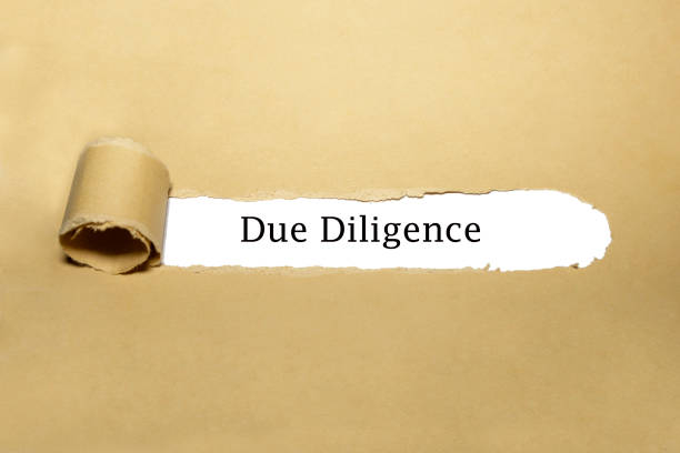 Due Diligence Risk Management Ripped Paper Concept stock photo