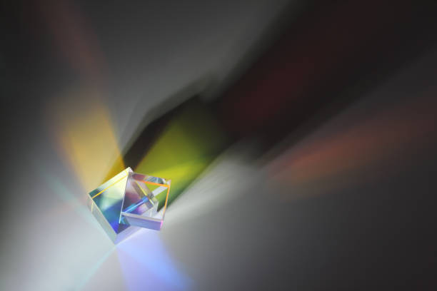 Two prism cubes are on top of each other and cast a long side shadow Two prism cubes are on top of each other, refract the light and cast a long side shadow. Top view to the surface facet joint photos stock pictures, royalty-free photos & images