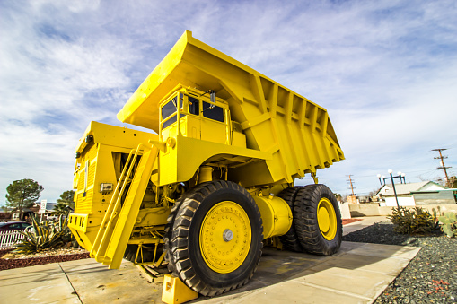 Monster Yellow Dump Truck On Display In Public Park