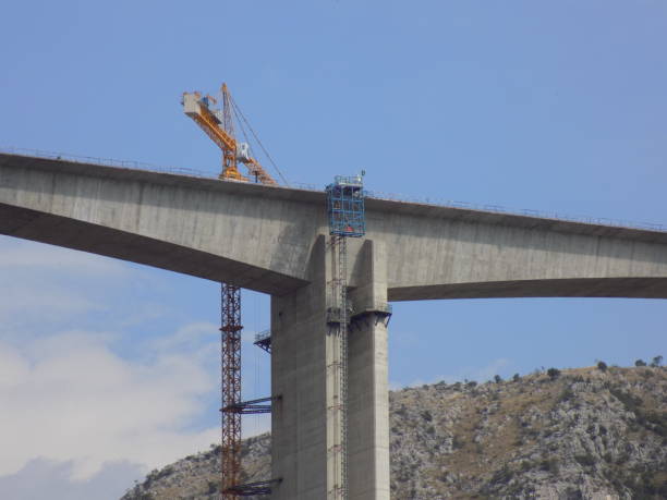 istock Construction of a bridge across the canyon 1199083236