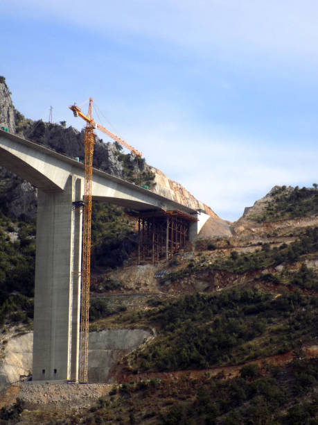istock Construction of a bridge across the canyon 1199083239