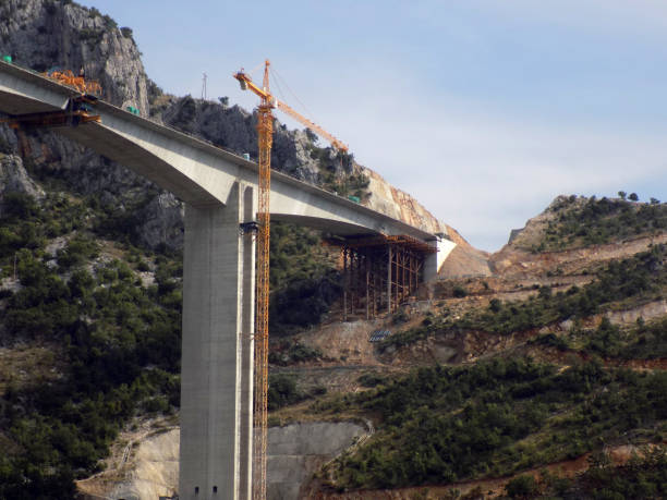 istock Construction of a bridge across the canyon 1199083241