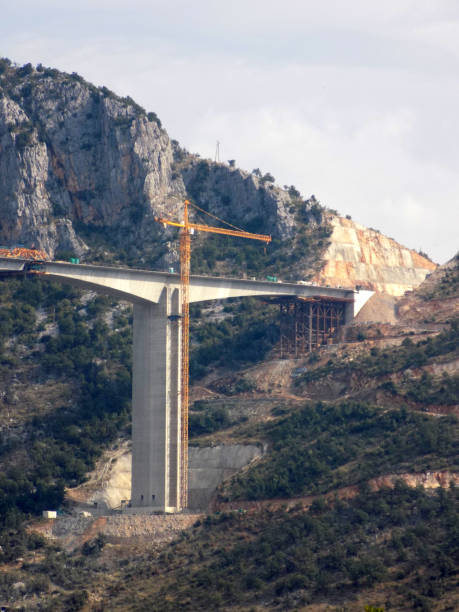 istock Construction of a bridge across the canyon 1199083247