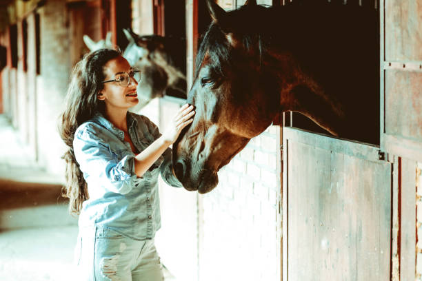istock Young woman and horse 1199083379