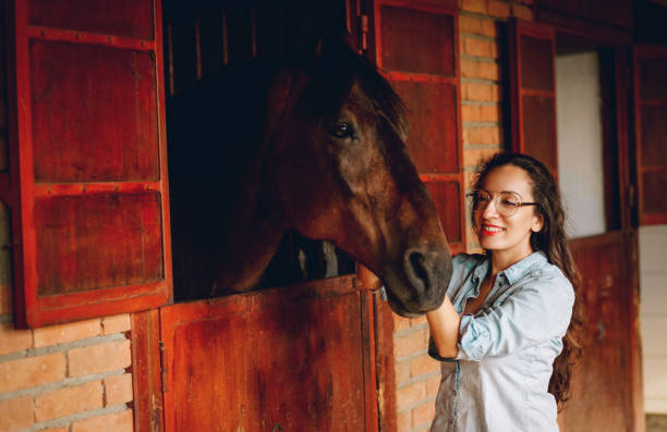 istock Young woman and horse 1199083423