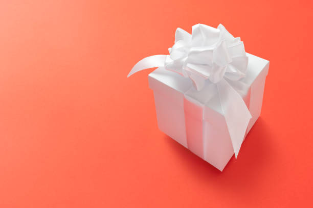 istock Gift box minimal background. Lush lava 2020 color trend 1199086664