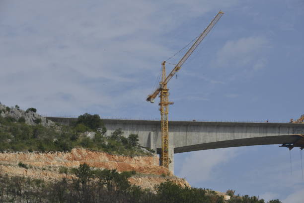 istock Construction of a bridge across the canyon 1199086730
