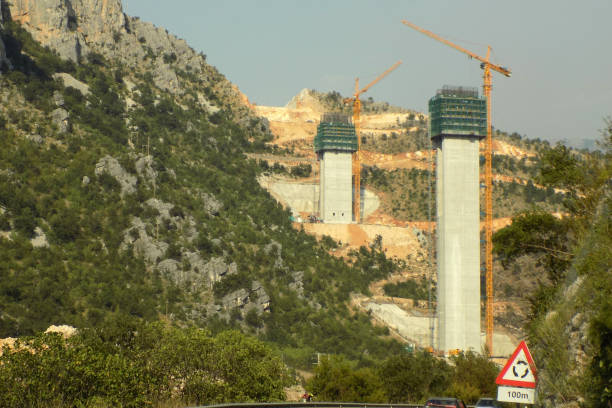 istock Construction of a bridge across the canyon 1199086921