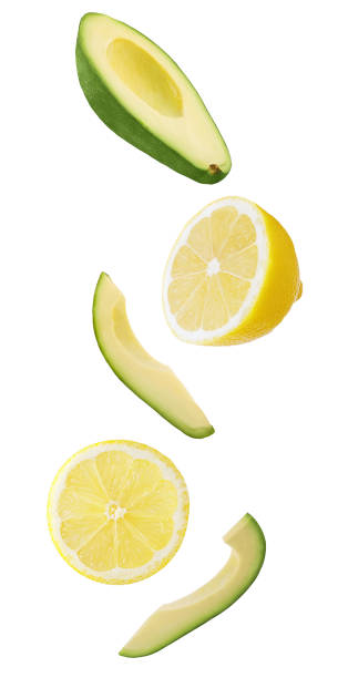 istock Floating avocado and lemon fruit isolated on white 1199096758
