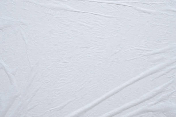 istock Blank white crumpled and creased paper poster texture background 1199097075