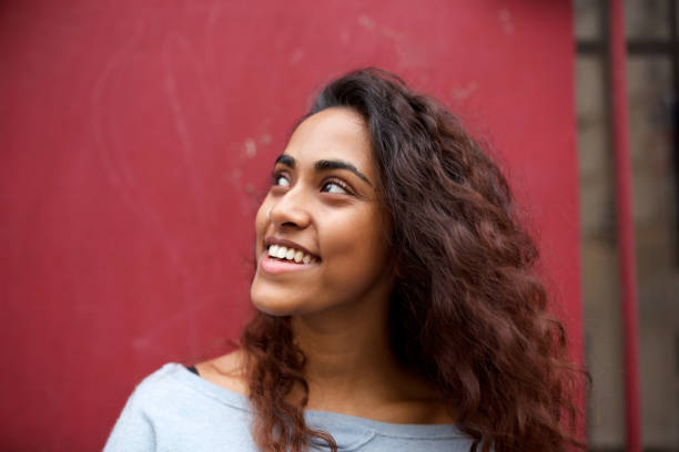 istock smiling young Indian woman looking away 1199097224