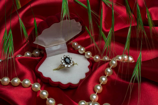 istock pink tulips with gold ring in box for Valentine day 1199098475