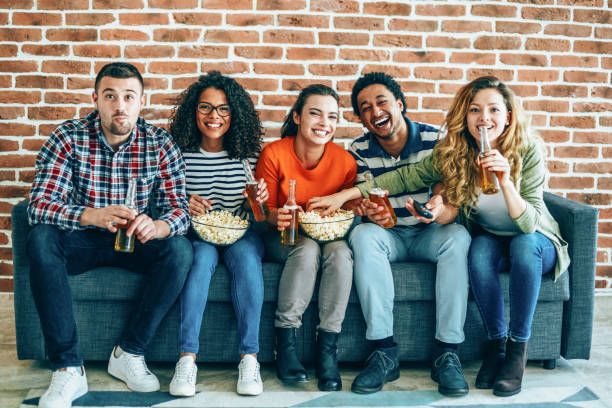 istock Group of friends watching tv 1199100419