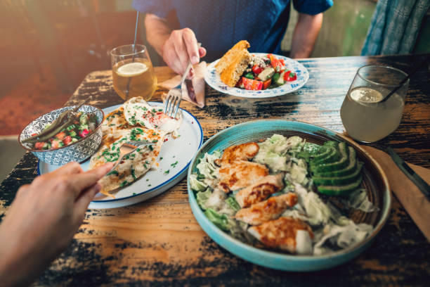 istock Couple eating healthy lunch at restaurant 1199100455