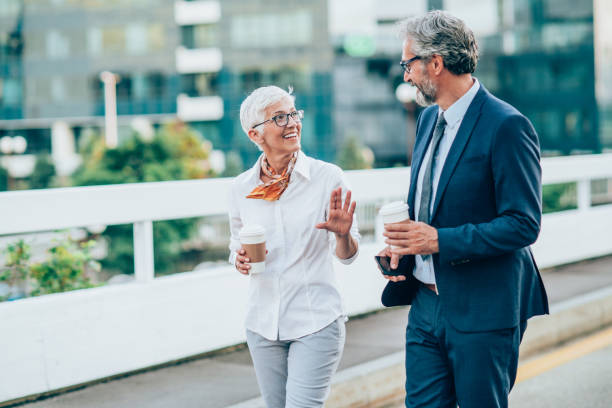 istock Business persons walking outdoors 1199100484
