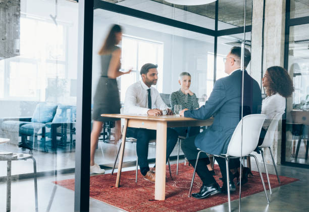 istock Team of professionals during a meeting. 1199100503