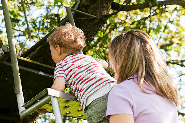 istock Family summer on ladder to tree house 119910312
