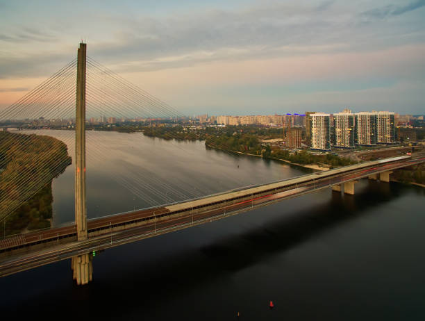 istock Traffic on a bridge. Modern metropolis with intersection of the traffic trails on a bridge. Traffic jams of roadside, transportation motion in a big city. 1199103349