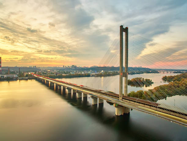 istock Traffic on a bridge. Modern metropolis with intersection of the traffic trails on a bridge. Traffic jams of roadside, transportation motion in a big city. 1199103353