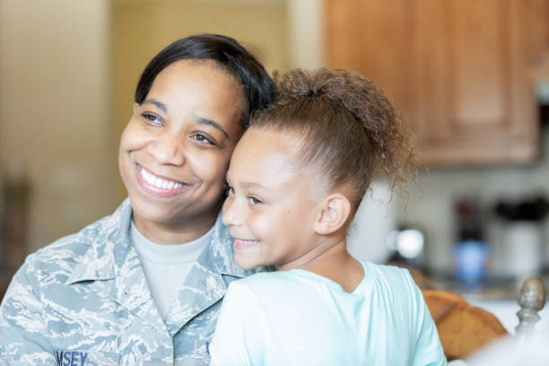 istock Soldier Mother spending time with daughter 1199103672