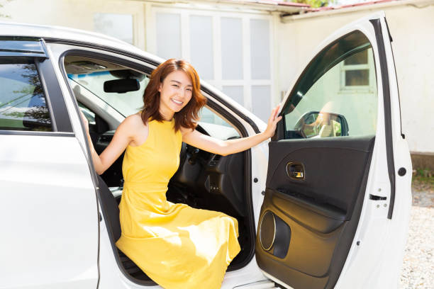 istock asian woman and car 1199104538