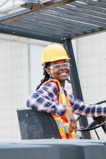 istock African-American woman operating forklift 1199107258